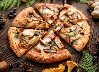 Mushroom pizza, pizza slices with addition of  edible wild mushrooms (porcini  mushrooms,...