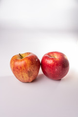 Fototapeta na wymiar Red delicious and fuji apples isolated against a white background