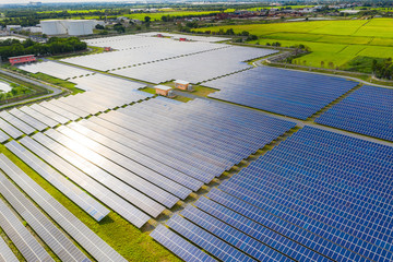 Solar energy farm producing clean renewable energy from the sun . Thousands of solar panels,...