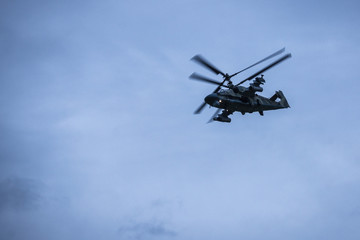 Fototapeta na wymiar Helicopter flight, military maneuvers.
