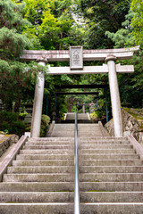 A torii, a gateway to Shiota hachiman-gu shrine in Kobe, Hyogo, Japan.  Translation; Japanese characters in the plate put on the gate means 