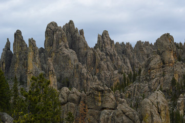 Pointy rock formation jutting into an overcast sky at Custer State Park