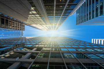 Modern office glasses buildings cityscape under blue clear sky in Washington DC, USA, outdoors financial skyscraper concept, symmetric and perspective architecture