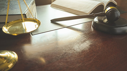 Judge gavel with Justice lawyers having team meeting at law firm background. Concepts of Law and...