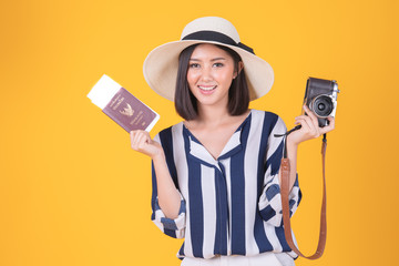 Tourist woman in summer casual clothes.Asian Smiling woman .Passenger traveling abroad to travel on yellow background.Asian woman going to summer vacation.Travel trip funny.