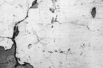 Texture of a concrete wall with cracks and scratches which can be used as a background