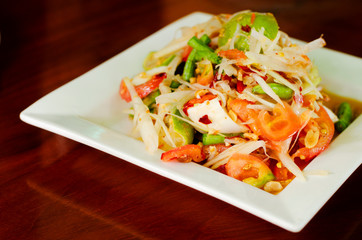 Tasty papaya salad the famous Thai foods on white dish