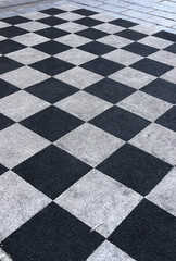 paving in the form of a geometric shape on the streets of the city as a background