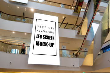 Mock up vertical LED Screen hanging from ceiling in shopping mall