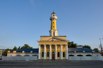 Fototapeta na wymiar Scenic view of the Fire tower in historical center of ancient town Kostroma in Russian Federation. Beautiful summer look of old building in old part of capital of russian province