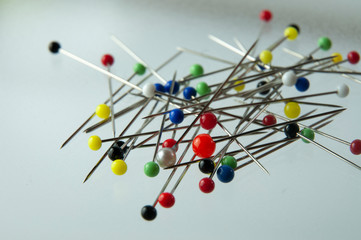 close-up of a heap of pins with colorful heads