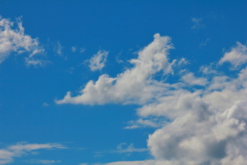 Fantastic soft white clouds against blue sky