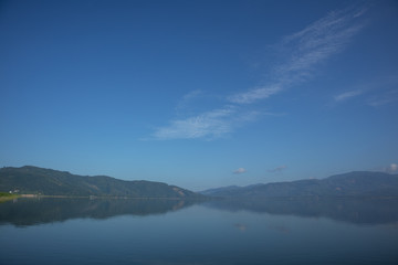 Clear white water reservoir bright blue sky