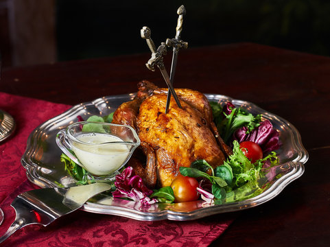 grilled chocken, vegetables and swords