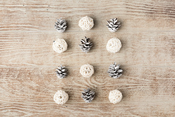 Christmas composition. Christmas decorations and pine cones on wooden rustic background. Flat lay, top view. Copy space. Banner backdrop