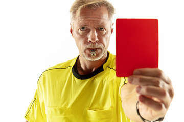 Referee showing a red card to a displeased football or soccer player while gaming isolated on white...