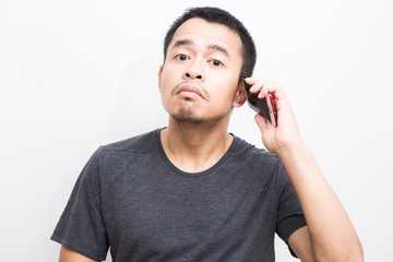 Business asian men intend using smartphone on white background