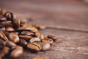 Coffee beans on dark wooden background