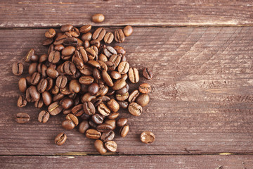 Coffee beans on dark wooden background