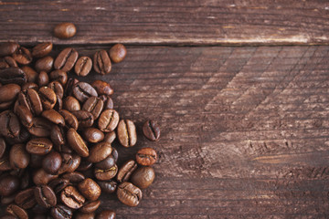 Coffee beans on dark wooden background