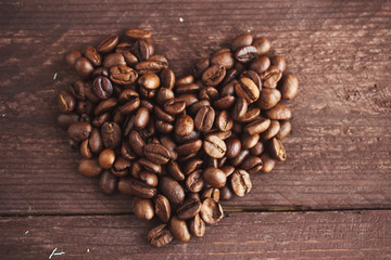 Coffee beans on dark wooden background