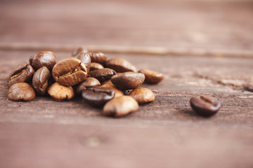 Coffee beans on dark wooden background