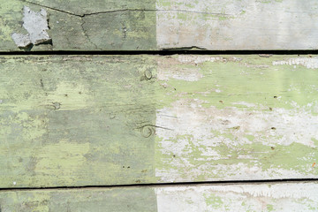 Light green and white wooden texture background. Old wood boards. Different scratches and lines. Grungy surface. Lines divide the picture into three parts. Background for text or design