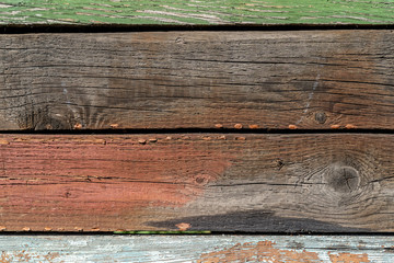 Coloured wooden texture background. Old wood boards. Different scratches and lines. White, red, green, grey, brown and blue colours. Background for text or design