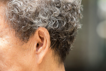 Senior woman's left  ear to listening, Close up, body concept