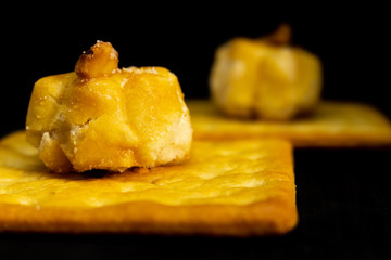 Cracker cookies on dark background.