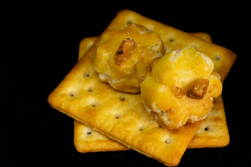 Cracker cookies on dark background.
