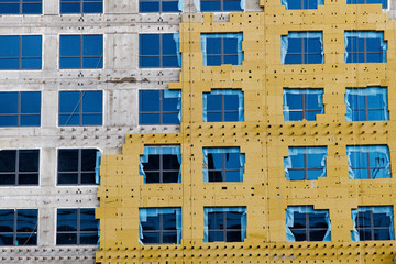 Construction of external wall thermal insulation with rock wool. Exterior passive house wall heat...