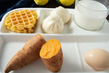 A balanced breakfast with a plate on the wooden table