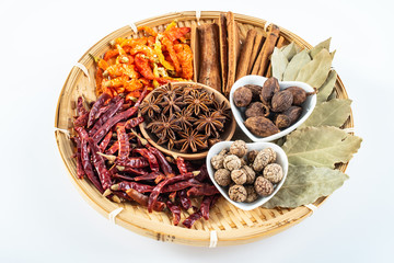 A plate of Chinese food commonly used spicy cooking seasoning spices on a white background