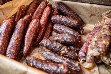 Variety of homemade dried sausages at the fresh market in London