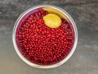 A bowl of recurrant berries and lemon ready for making jam - 1