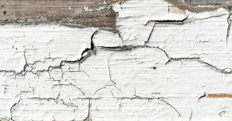 Wooden texture background. Old wood texture with white peeling paint. Grey and brown colours of wood. Different cracks. Background for text or design