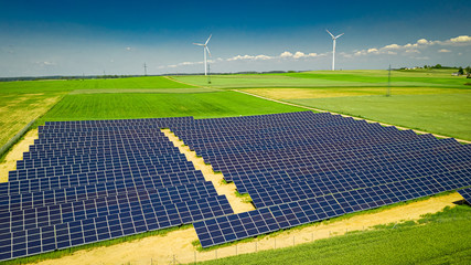 View of solar panels and wind turbine, Poland from above