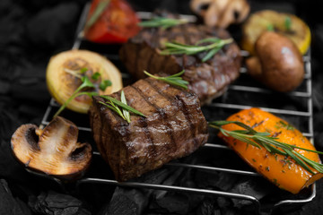 Close up of fresh meat steak prepared on coals