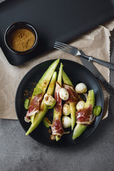 Melon salad with prosciutto and cheese..