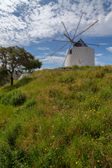 Old windmill on a hill in Odeceixe at the Algarve, Portugal.