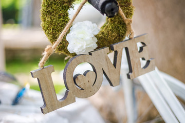Wooden love sign . Rustic wedding decoration