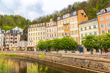 Fototapeta na wymiar City river and old buildings, Karlovy Vary