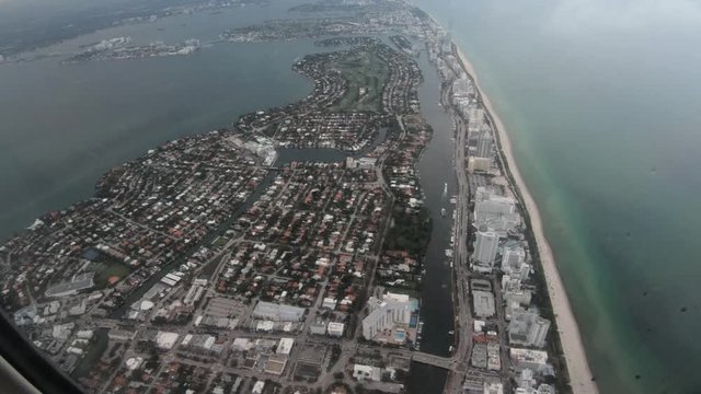 View from airplane window, landing in Miami on rainy day