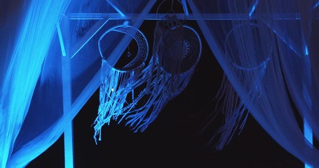 Decorative festive blue lighted fabric background.