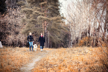Young girl on a walk in the autumn