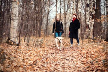 Fototapeta premium Young girl on a walk in the autumn