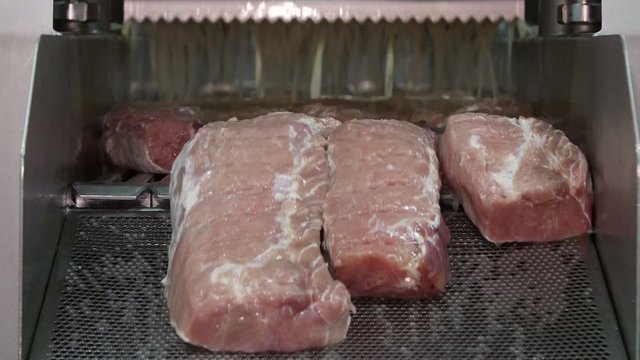 Brine injection of pork in a meat processing factory