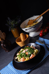 pappardelle pasta with creamed spinach and fried salmon