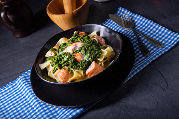 pappardelle pasta with creamed spinach and fried salmon